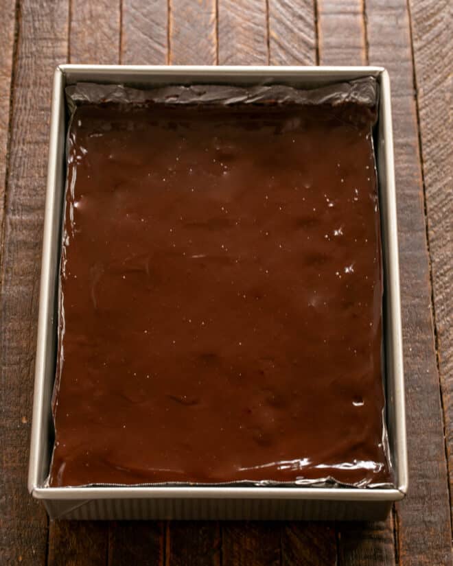 Top cooled brownies with ganache.