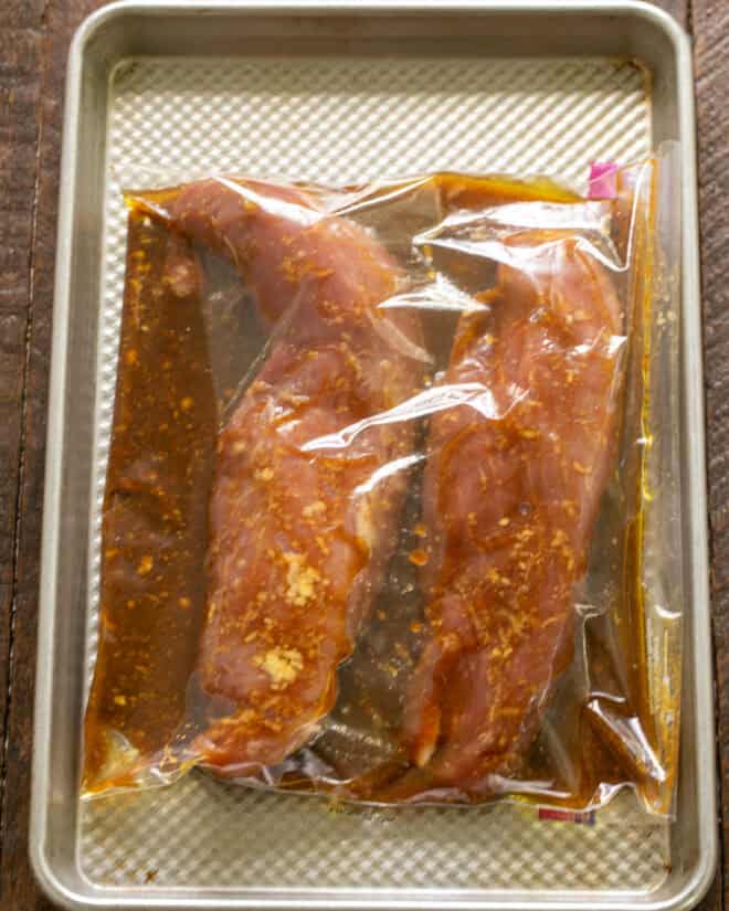 Pork and marinade in a Ziploc bag.